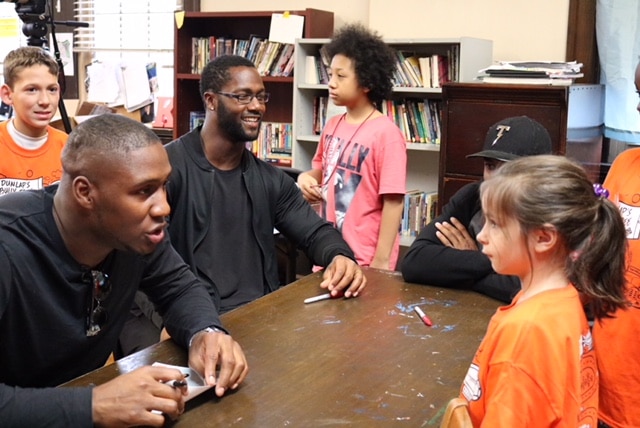 Carlos Dunlap talks with kids on his anti-bullying tour. Image courtesy of the Carlos Dunlap Foundation.